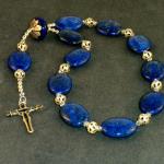 Lapis ovals (20mm) sterling silver spacers with Swarovski crystal accents. Sterling silver cross by Connecticut artist Dan Riccio  $125.00  plus  $5.20 S/H