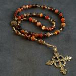 Sardonyx roundels (12mm) with gold vermeil bead caps and Swarovski crystal accents, bronze casting of antique Ethiopean cross  $75.00 plus $5.20 S/H