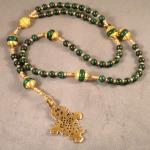 Dark Malachite (6mm), paters of Malachite roundels with gold vermeil bead caps accented with Swarovski crystals. Bronze casting of antique Ethiopean cross. $135.00 plus $7.95 S/H/Insurance.