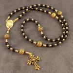 Item R5. Black onyx - 4mm- gold plated connector with Jesus and blessed Virgin Mary - ornately patterned Paters and gold plated fleur de lis cross ($ 36 plus $5.20 S/H)