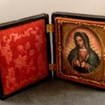 Our Lady of Guadalupe in antique Daguerrotype frame. Approximate size 3.5" H x 2.75" W when the frame is closed. Image under glass. Lovely detail in the pressed metal decorative oval  and pressed velvet floral design. $85.00 plus $4.95 S/H.